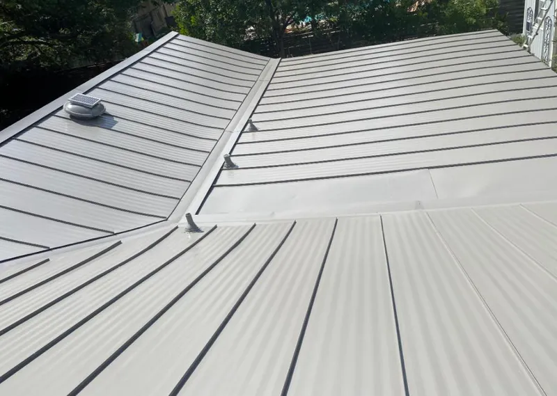 Solar attic fan installed on a metal roof for Roof Ventilation in Wauchula